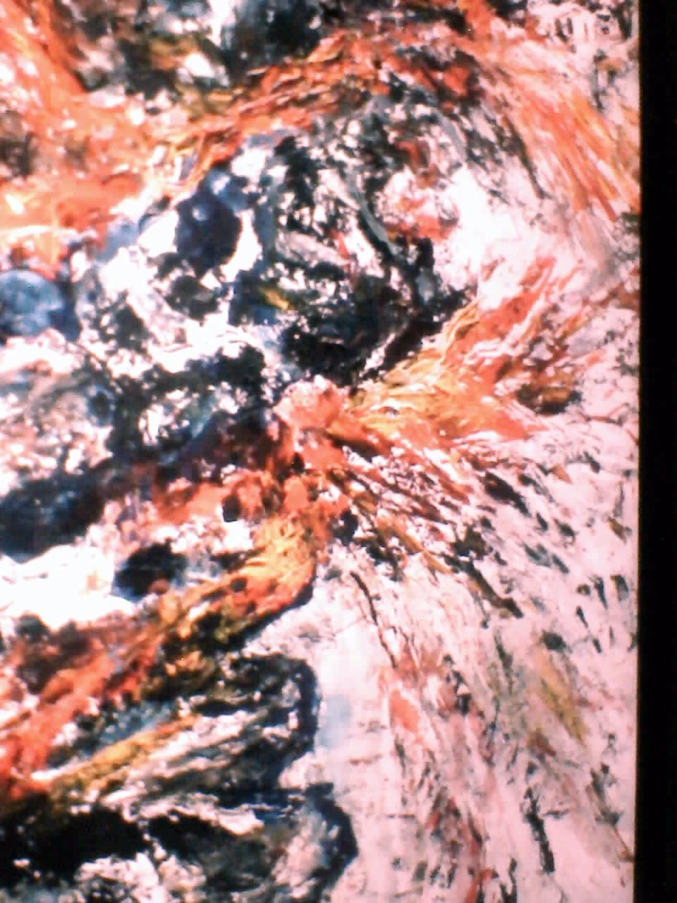 a painting of a red and black substance