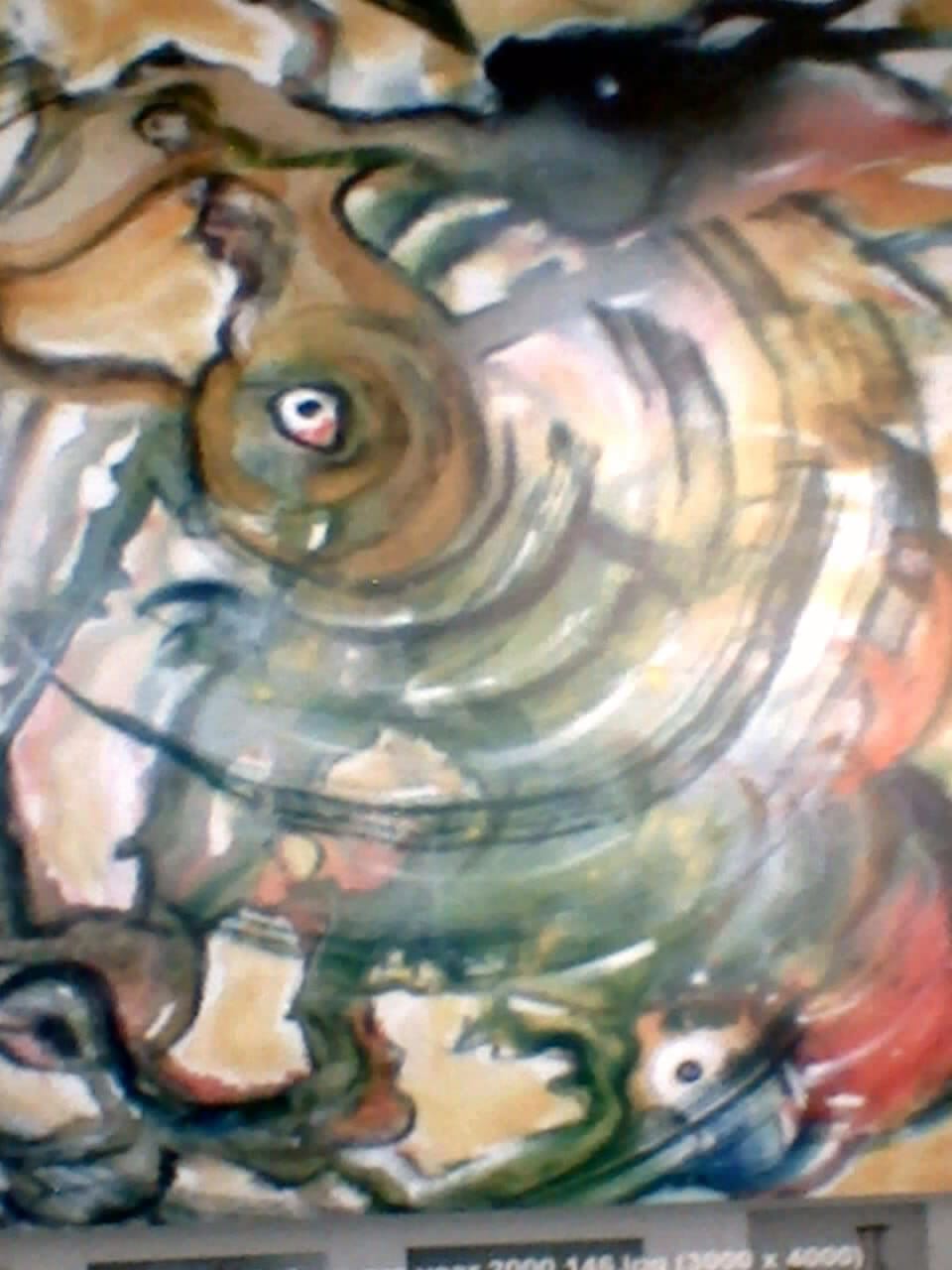 a painting of a spiral design on a wall