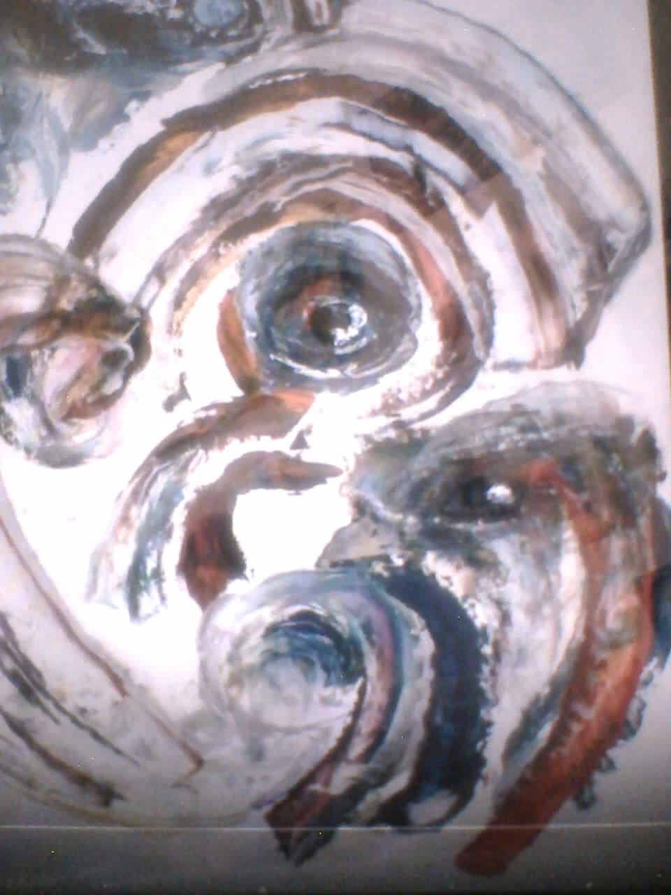 a painting of a face with many different colors